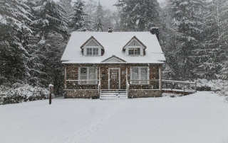 Fire safety tips for the winter season house with snow outside